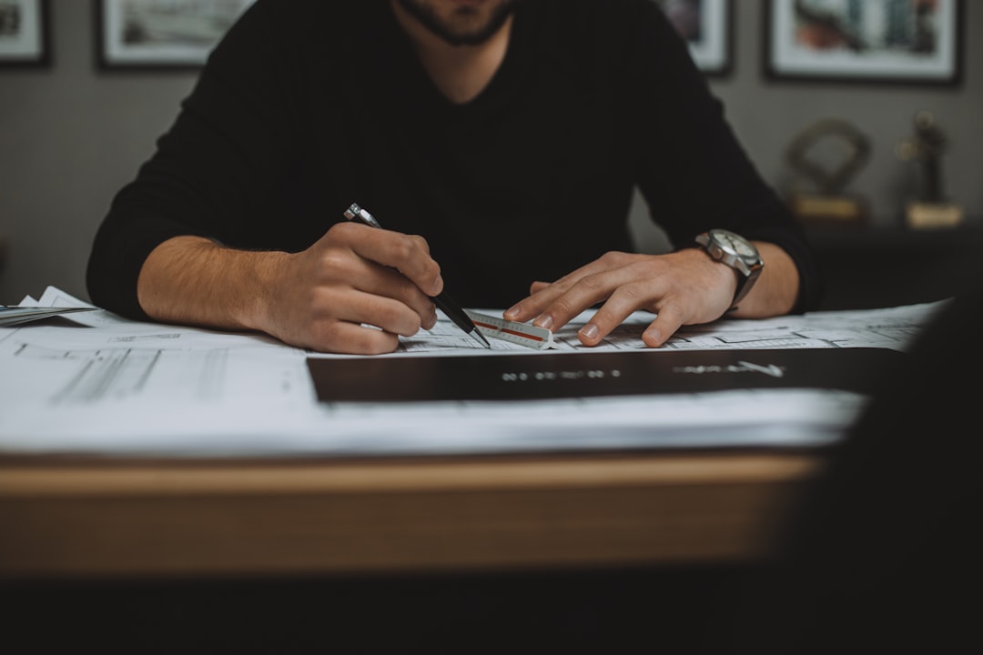 man-in-black-long-sleeve-shirt-using-black-laptop-computer-ypm-6qkbori